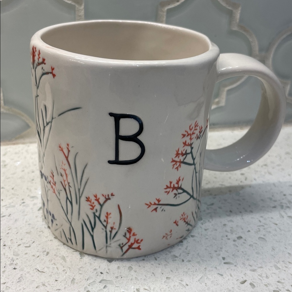 Anthropologie White Ceramic Mug with Black 'B' and Coral Floral Accents